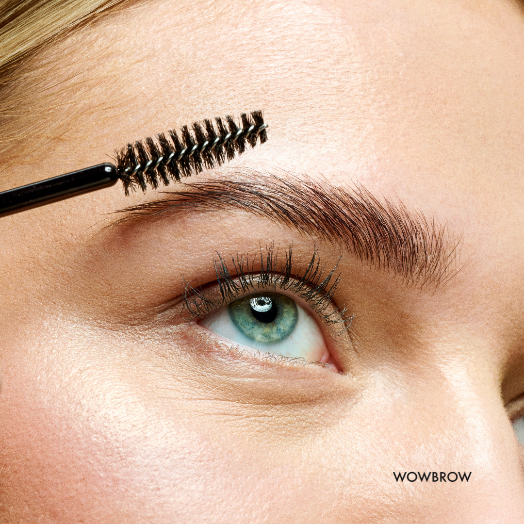 Extreme close-up of a well-groomed eyebrow styled with WOWBROW Brow Wax